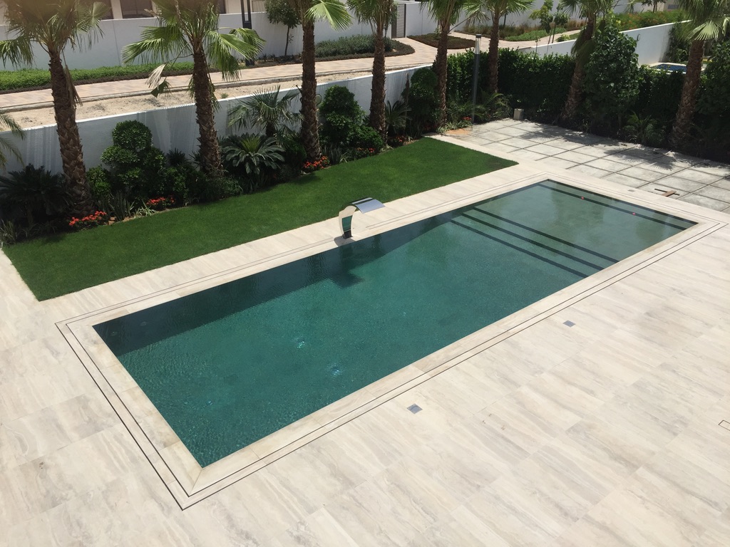 Luxury Overflow Mirror Pool with Bali Tiles | District One Dubai – Custom Luxury Mirror Pool with Bali Ceramic Tile Finishes & RGB Lighting