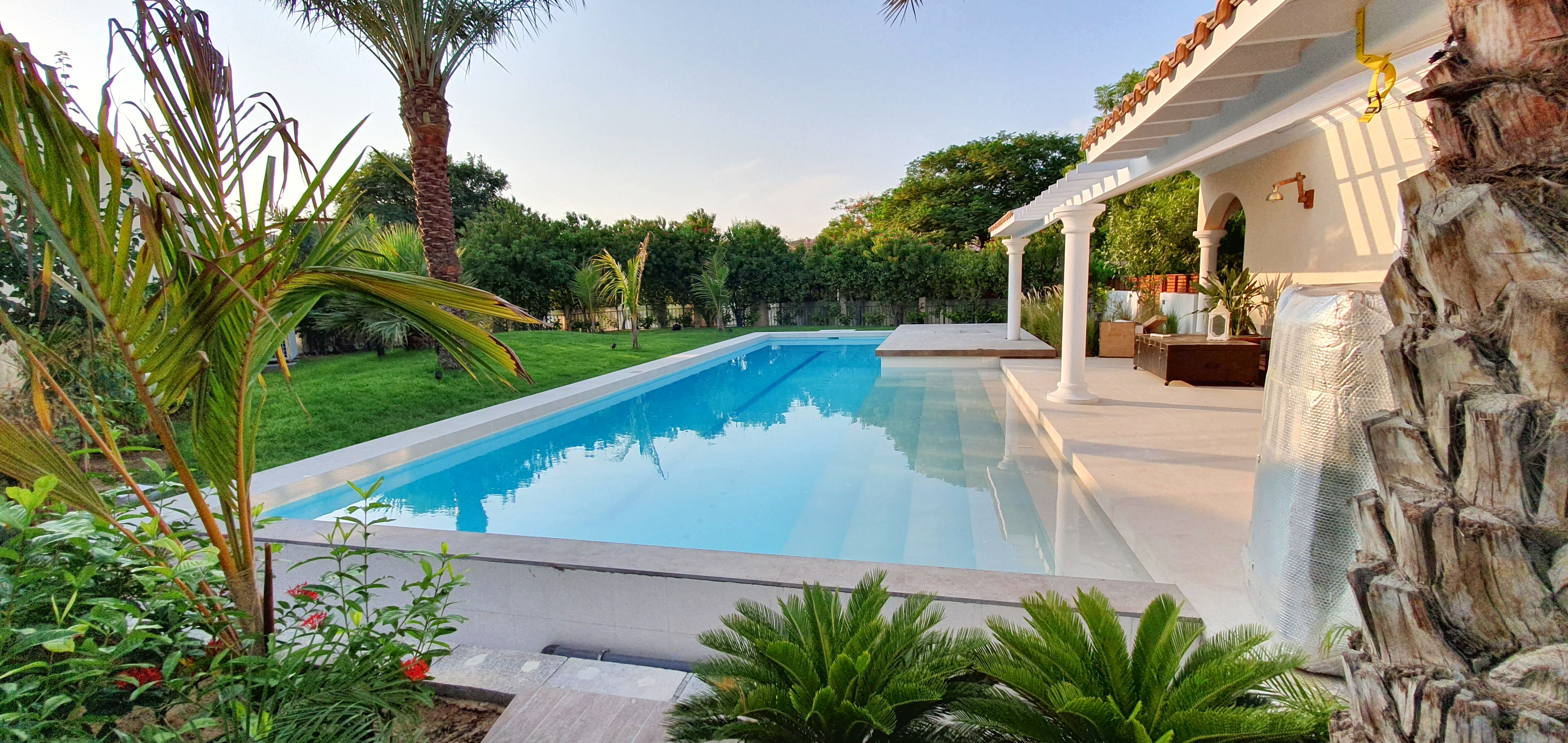 Elegant Luxury Skimmer Pool | Green Community Dubai – Custom Residential Skimmer Swimming Pool with Ceramic Tile Finishes