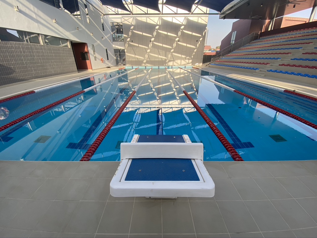 Semi-Olympic Overflow Swimming Pool | Dubai College Jumeirah Dubai – Large-Scale Commercial School Swimming Pool with LED Lighting