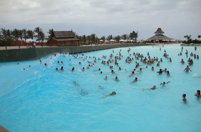 Wave generating system for water parks and pools