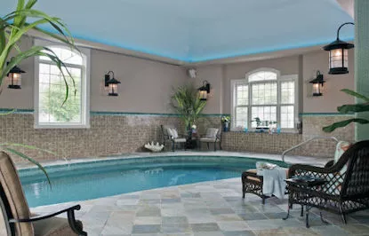 Luxury indoor swimming pool with ambient lighting and contemporary design
