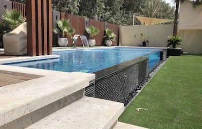 Infinity pool with a breathtaking seamless edge overlooking a scenic view